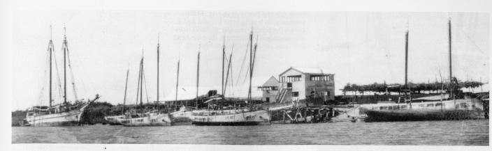 An image of boats by a campsite. 